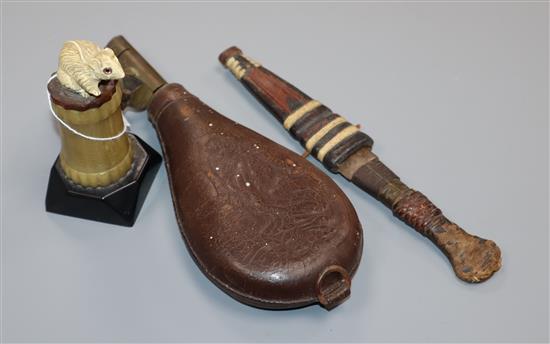 A 1930s Bakelite mouse lighter, a powder flask and a knife